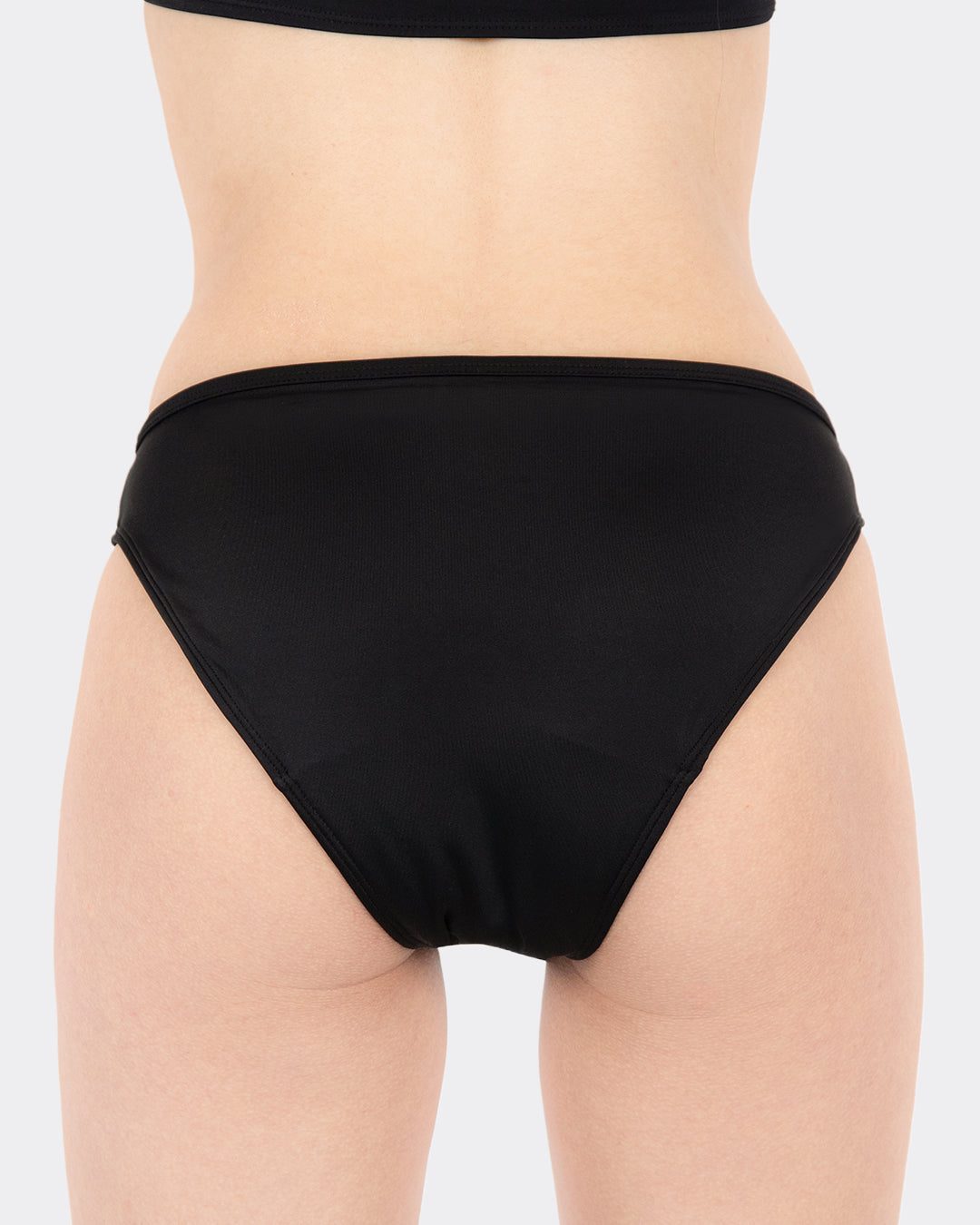 Rückansicht der schwarzen MYLILY Teens Perioden Bikinihose mit zuverlässigem Auslaufschutz
